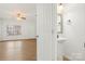 Clean, simple bathroom with pedestal sink and decorative mirror at 611 Cahill Ln, Fort Mill, SC 29715