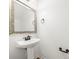 Small powder room with a pedestal sink and bronze fixtures at 611 Cahill Ln, Fort Mill, SC 29715