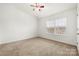 Spacious bedroom featuring a large window and ceiling fan at 611 Cahill Ln, Fort Mill, SC 29715