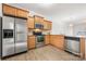 Stainless steel appliances and light wood cabinets in kitchen at 611 Cahill Ln, Fort Mill, SC 29715