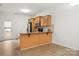 Modern kitchen with light wood cabinets and granite countertops at 611 Cahill Ln, Fort Mill, SC 29715