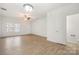 Bright living room with vinyl flooring and access to other rooms at 611 Cahill Ln, Fort Mill, SC 29715