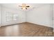 Bright living room with hardwood floors and ceiling fan at 611 Cahill Ln, Fort Mill, SC 29715