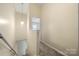 Upstairs hallway with neutral walls and carpeting at 611 Cahill Ln, Fort Mill, SC 29715