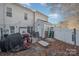 Fenced backyard with patio, grill, and storage shed at 8044 Sapwood Ct, Matthews, NC 28104