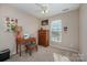 Cozy bedroom featuring a window, dresser, and charming decor at 8044 Sapwood Ct, Matthews, NC 28104