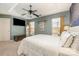 Bedroom with TV, dresser, and ceiling fan at 8044 Sapwood Ct, Matthews, NC 28104