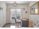 Bright dining area with a wooden table and chairs at 8044 Sapwood Ct, Matthews, NC 28104