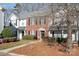 Brick and white townhome with landscaping and walkway at 8044 Sapwood Ct, Matthews, NC 28104