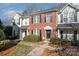 Two story townhome with a brick exterior and landscaping at 8044 Sapwood Ct, Matthews, NC 28104