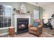 Inviting fireplace with a leather armchair at 8044 Sapwood Ct, Matthews, NC 28104