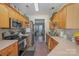 Modern kitchen with stainless steel appliances and wood cabinets at 8044 Sapwood Ct, Matthews, NC 28104