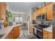 Modern kitchen with stainless steel appliances and wood cabinets at 8044 Sapwood Ct, Matthews, NC 28104