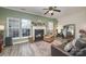 Living room with fireplace, leather chairs, and rug at 8044 Sapwood Ct, Matthews, NC 28104