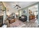 Cozy living room featuring a fireplace and a leather armchair at 8044 Sapwood Ct, Matthews, NC 28104