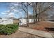 Landscaped entrance to a neighborhood park with a walkway and trees at 8044 Sapwood Ct, Matthews, NC 28104