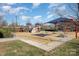 playground with play structures, shaded seating, and ample space at 8044 Sapwood Ct, Matthews, NC 28104