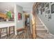 Staircase with a gallery wall in the hallway at 8044 Sapwood Ct, Matthews, NC 28104