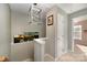 Upstairs hallway with a light fixture and access to bedrooms at 8044 Sapwood Ct, Matthews, NC 28104