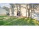 Small patio and fenced backyard with grassy area at 8146 Rudolph Rd, Charlotte, NC 28216