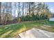 Private backyard with grassy area and concrete patio at 8146 Rudolph Rd, Charlotte, NC 28216