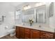 Bathroom with double vanity and shower at 8146 Rudolph Rd, Charlotte, NC 28216