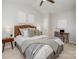 Bedroom with queen bed, desk, and ceiling fan at 8146 Rudolph Rd, Charlotte, NC 28216