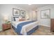 Spacious main bedroom with a king-size bed and en-suite bathroom at 8146 Rudolph Rd, Charlotte, NC 28216