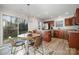 Open concept dining area and kitchen with stainless steel appliances at 8146 Rudolph Rd, Charlotte, NC 28216