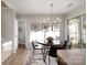 Casual dining area with view of half bathroom and stairs at 8146 Rudolph Rd, Charlotte, NC 28216