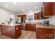 Well-equipped kitchen with dark wood cabinets and stainless steel appliances at 8146 Rudolph Rd, Charlotte, NC 28216