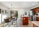 Modern eat-in kitchen with stainless steel appliances and island at 8146 Rudolph Rd, Charlotte, NC 28216