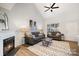 Bright living room with vaulted ceiling, fireplace, and hardwood floors at 8146 Rudolph Rd, Charlotte, NC 28216