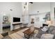 Two-story living room with hardwood floors and fireplace at 8146 Rudolph Rd, Charlotte, NC 28216