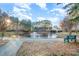 Serene pond with a fountain and walking path at 8146 Rudolph Rd, Charlotte, NC 28216