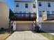 Attached garage with deck above at 9323 Lenox Pointe Dr, Charlotte, NC 28273