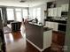 Modern kitchen with white cabinets, granite countertops, and stainless steel appliances at 9323 Lenox Pointe Dr, Charlotte, NC 28273