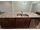 Kitchen island with granite countertop and double sink at 10028 Nw Trailhead Nw Way, Huntersville, NC 28078