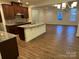 Open kitchen with granite countertops and island at 10028 Nw Trailhead Nw Way, Huntersville, NC 28078