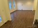 Spacious living room featuring wood-look flooring at 10028 Nw Trailhead Nw Way, Huntersville, NC 28078