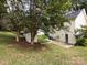 View of backyard, shed, and house exterior at 104 Pratt St, Belmont, NC 28012