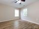 Spacious bedroom with hardwood floors and two windows at 104 Pratt St, Belmont, NC 28012