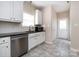 Kitchen with white cabinets and stainless steel appliances at 104 Pratt St, Belmont, NC 28012