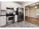 Updated kitchen featuring stainless steel appliances and hardwood floors at 104 Pratt St, Belmont, NC 28012