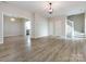 Spacious living room with hardwood floors and stairs at 104 Pratt St, Belmont, NC 28012