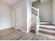 Elegant staircase with wood steps and white railing at 104 Pratt St, Belmont, NC 28012