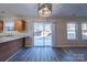 Kitchen dining area with sliding glass door to backyard at 10502 Haddington Nw Dr, Charlotte, NC 28269