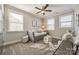 Bright bedroom with daybed, two chairs, and ample natural light at 12014 Grey Partridge Dr, Charlotte, NC 28278