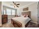 Comfortable bedroom with ceiling fan and a queen-size bed at 12014 Grey Partridge Dr, Charlotte, NC 28278