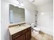 Clean bathroom, granite countertop, and bathtub shower combo at 14916 Oregon Oak Ct, Mint Hill, NC 28227